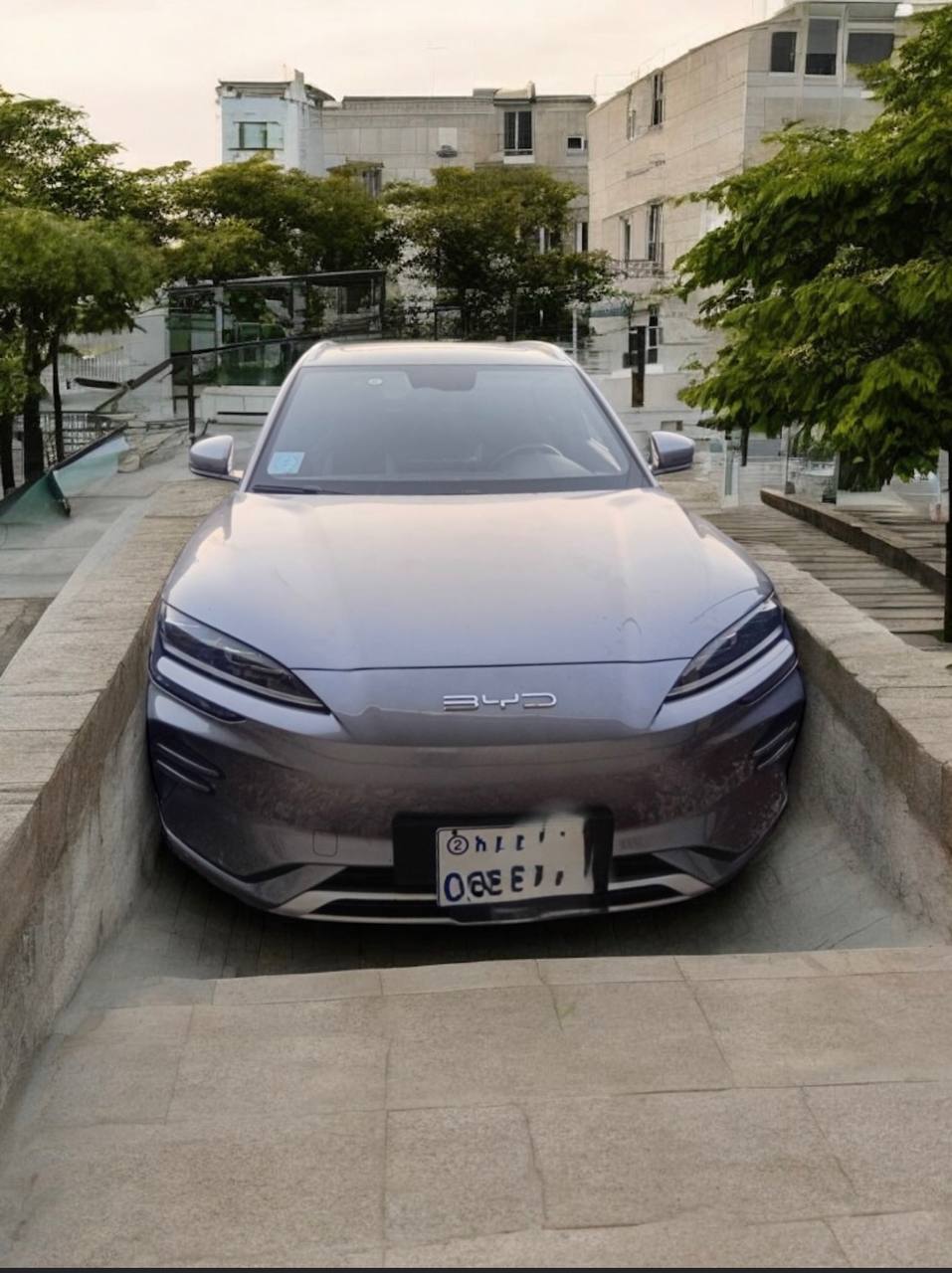 2024 BYD Song Plus Smart (SA3) SUV in dark gray color, showcasing its modern design and features.