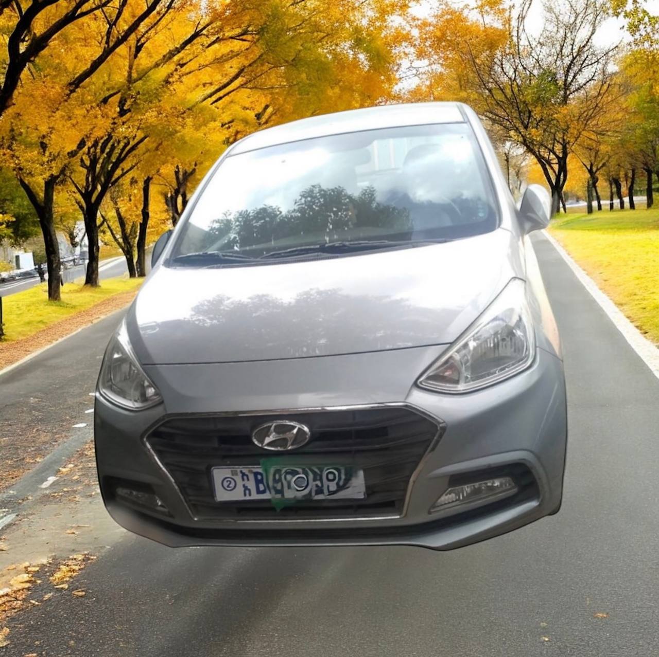 Image of a 2020 Hyundai Grand i10 (Aura) Sedan for sale, showcasing its sleek design and advanced features, including an 8-inch touchscreen and stylish alloy wheels.