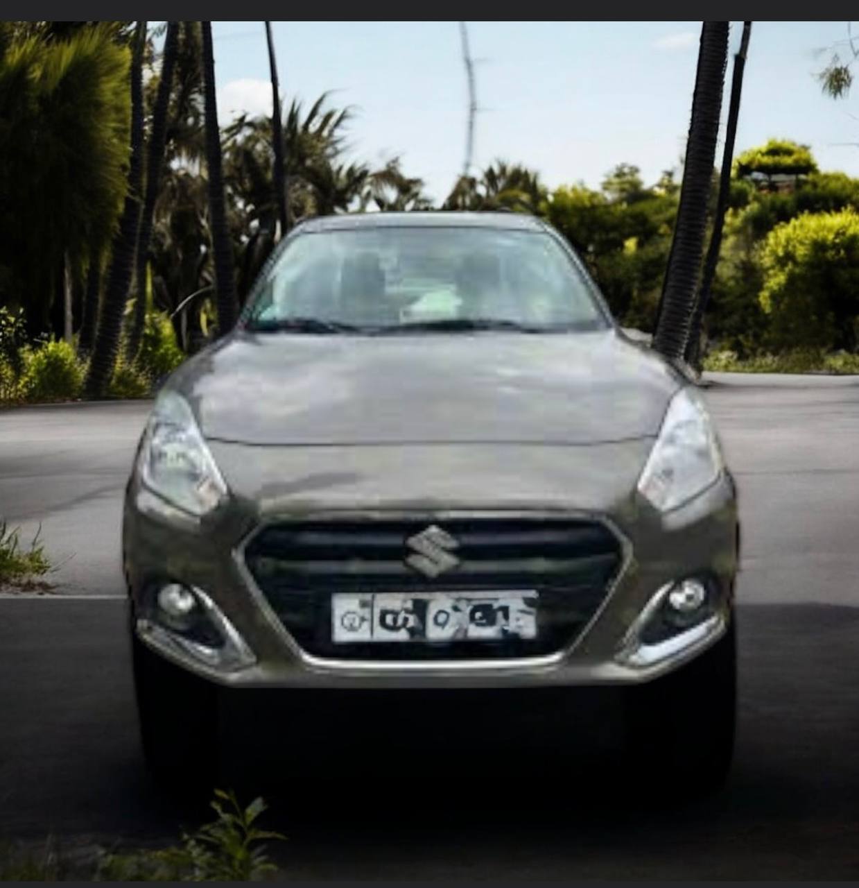2022 Suzuki Dzire Subcompact Sedan in Factory Saddle Brown Parked in Urban Setting