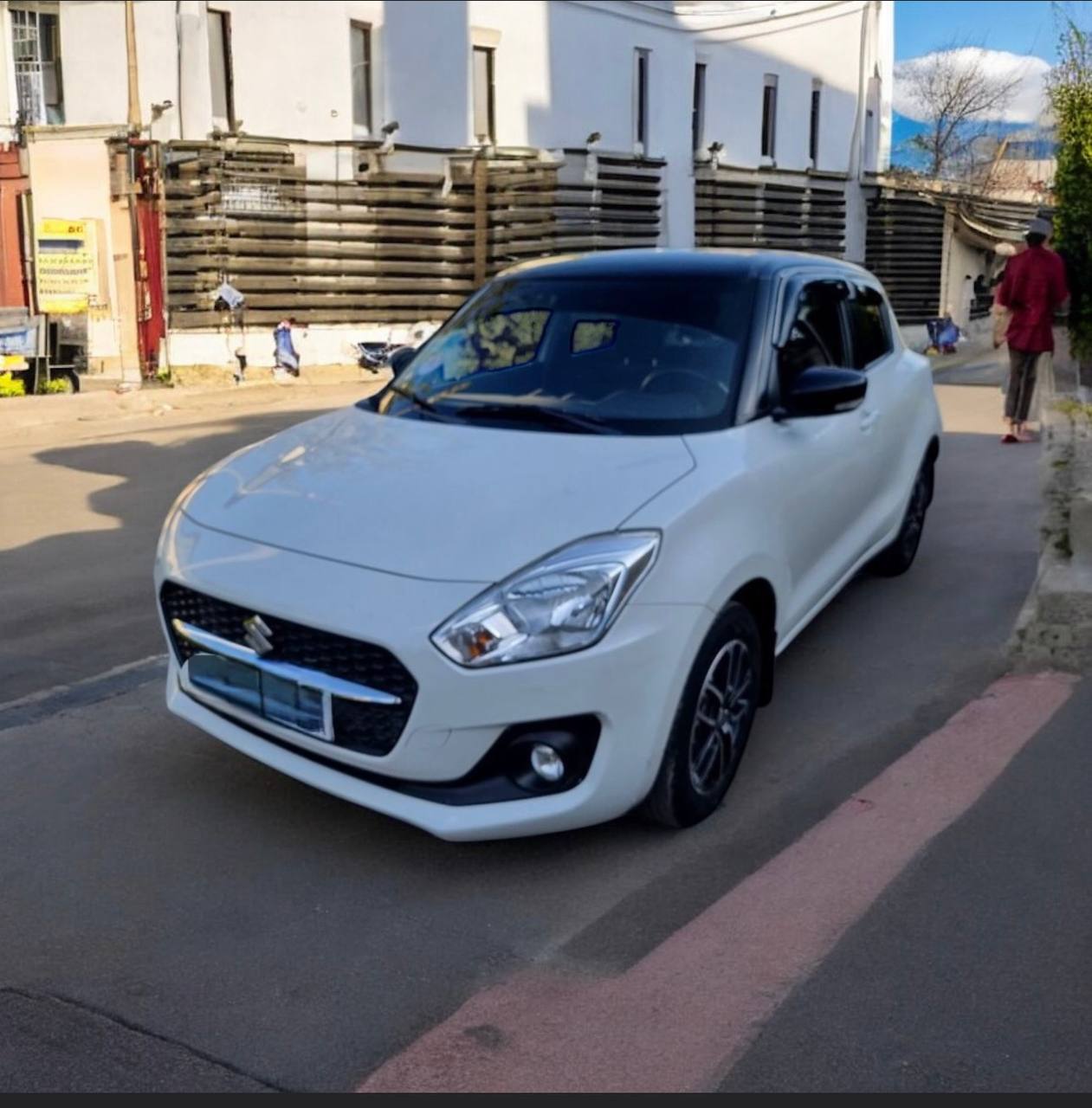 "2022 Suzuki Swift Hatchback in pristine condition, showcasing its original factory color and modern design."