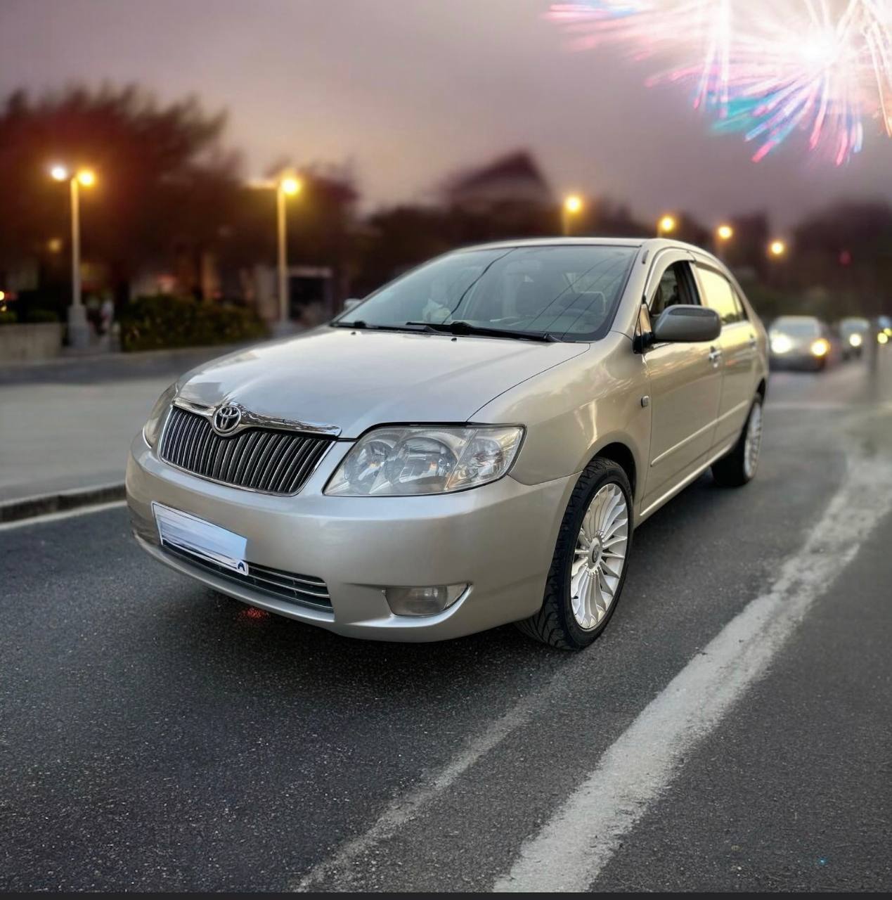 2007 Toyota Corolla XL (E120) Sedan in silver color, showcasing a well-maintained exterior and spacious interior features.