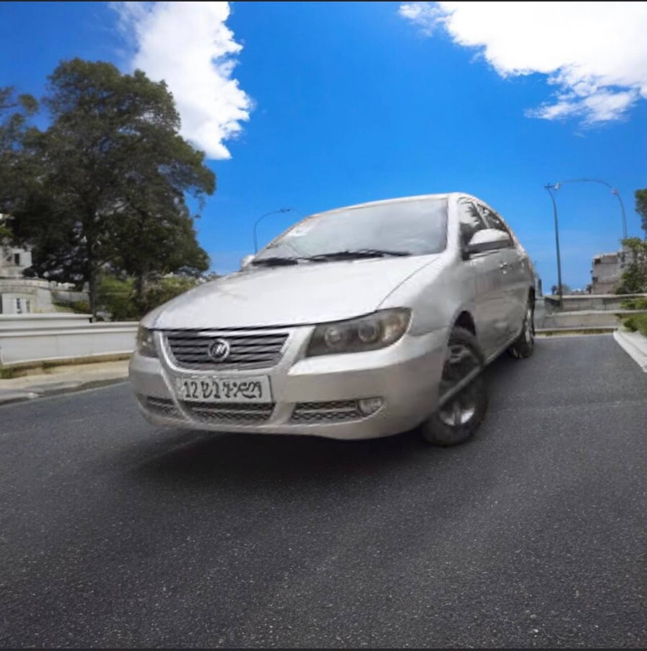 2010 Lifan 620 Compact Sedan parked on a city street, showcasing its sleek design and 4-door structure.