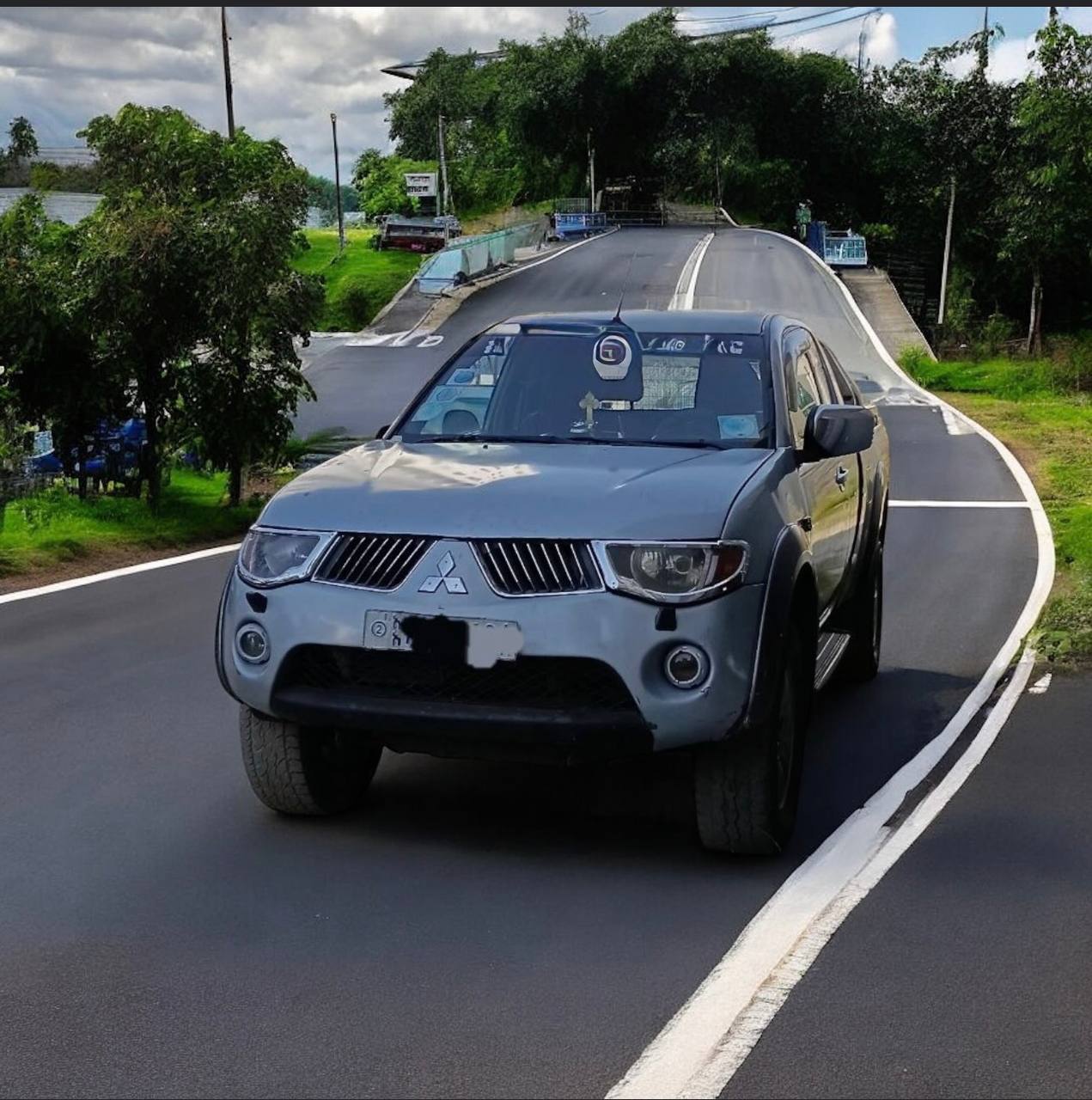 2006 Mitsubishi Triton L200 Extra Cab Pickup parked, showcasing its robust exterior and impressive design.