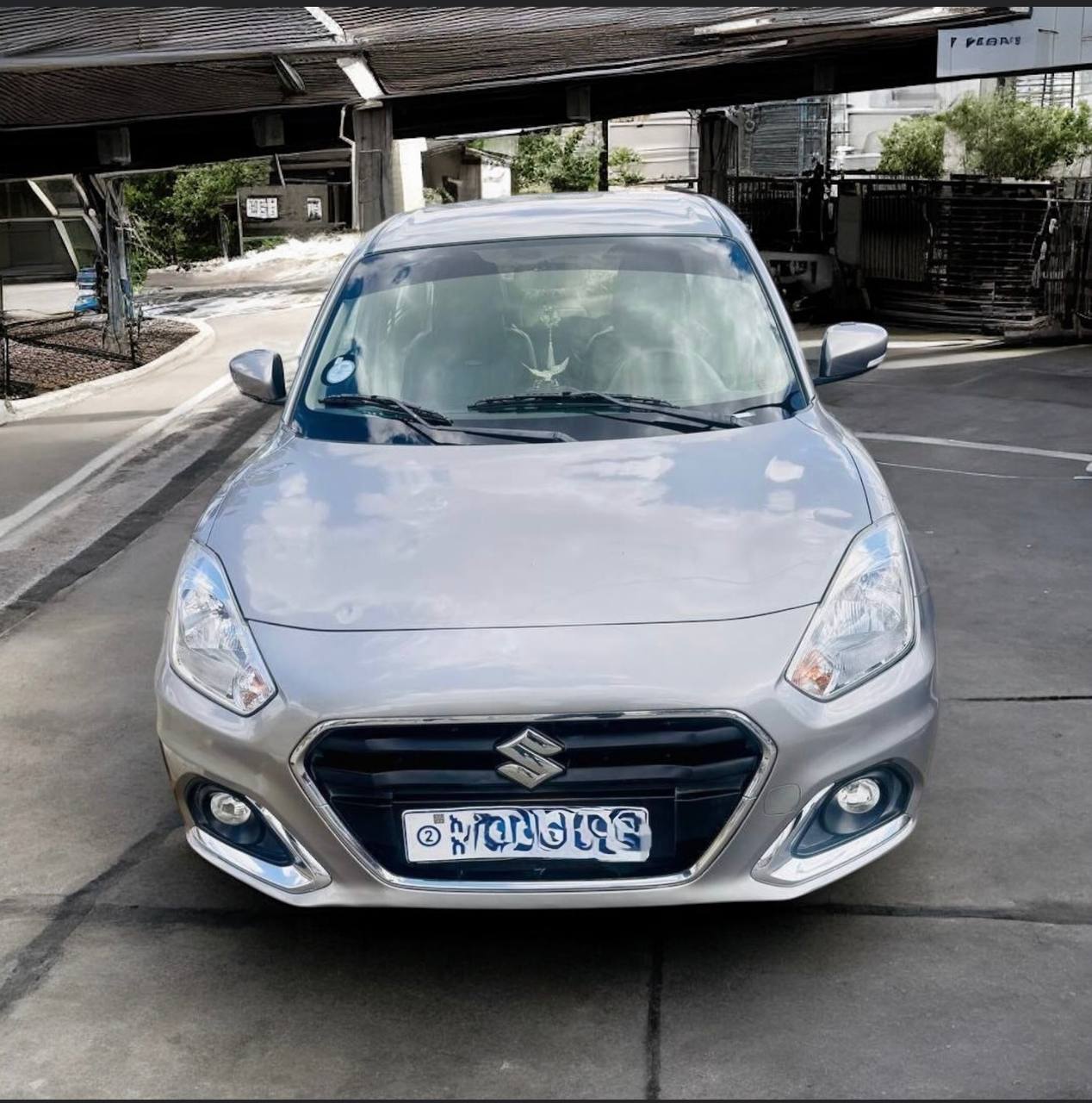 2021 Suzuki Dzire in Saddle Brown, showcasing its sleek design and modern features.
