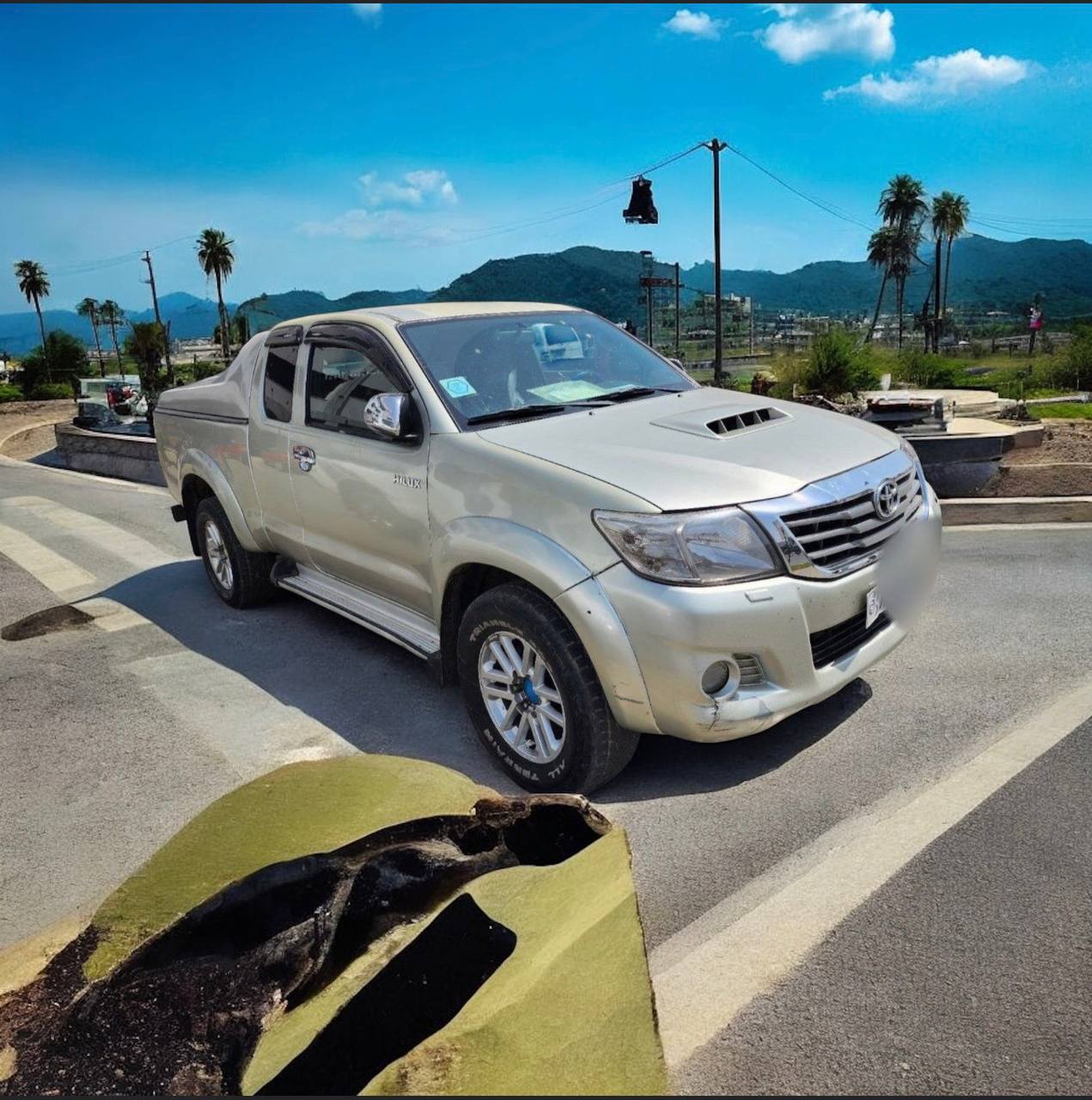 2012 Toyota Hilux Extra Cab in white color, available for sale in Addis Ababa, Ethiopia.