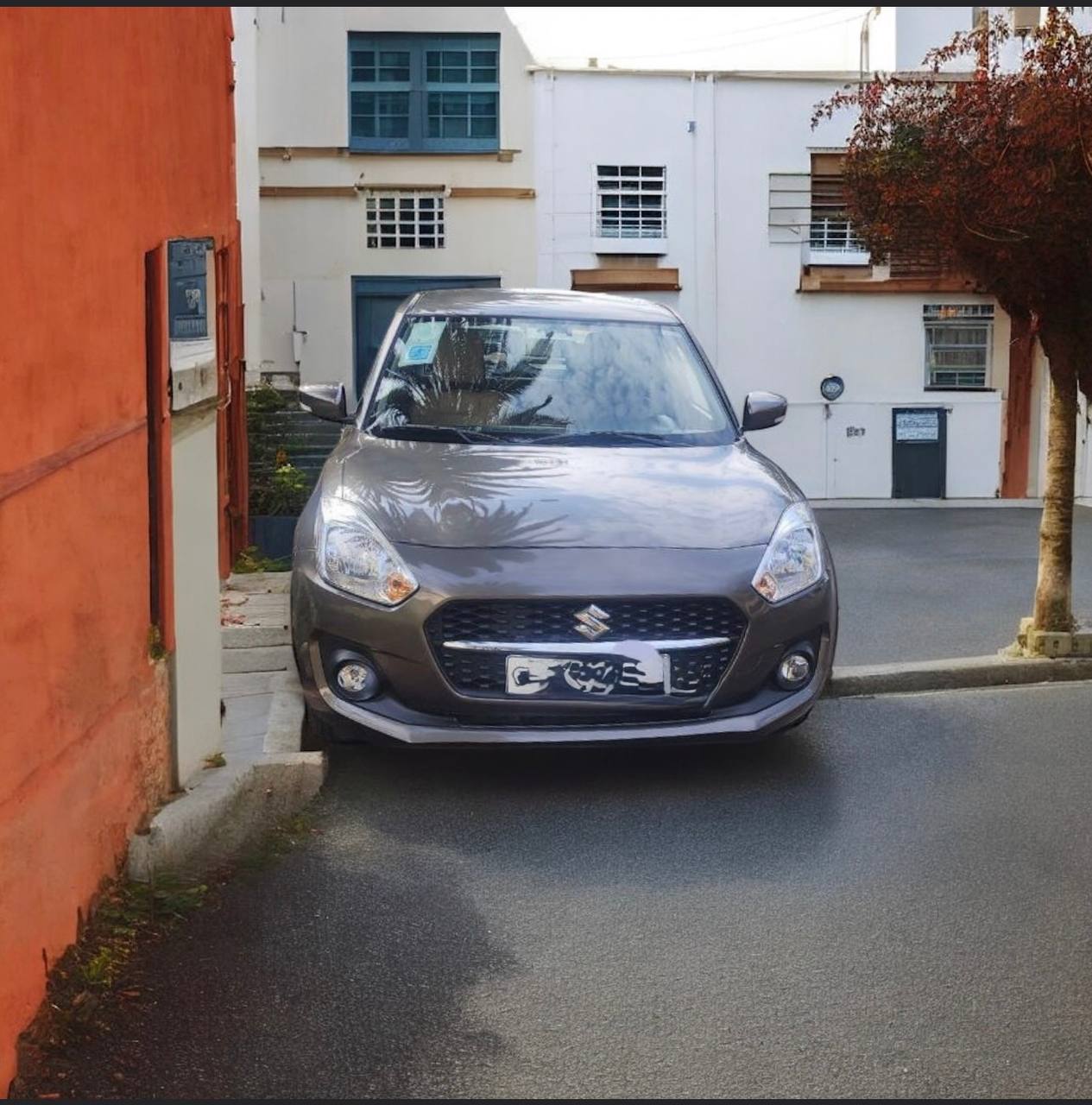 Exterior Front: Front view of a white 2022 Suzuki Swift for sale in Addis Ababa, showcasing LED headlights and pristine factory paint. Interior/Dashboard: Modern interior of 2022 Suzuki Swift featuring touchscreen with Apple CarPlay, Android Auto, and D-shaped multifunction steering wheel. Rear View: Rear profile of 2022 Suzuki Swift (A2L) showing original factory condition and 98% tread life on tires. Engine Bay: Meticulously maintained 1.2L K12N Dual Jet engine of a used Suzuki Swift in Ethiopia, 26,000 km mileage.