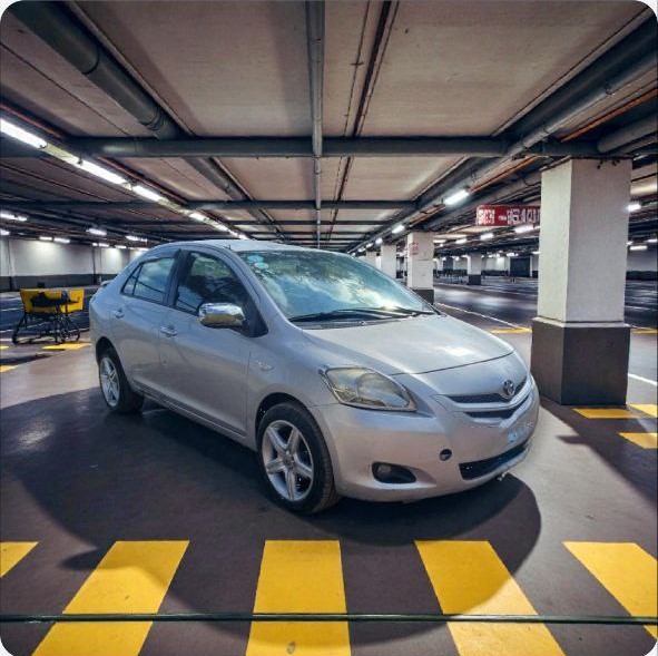 Silver Toyota Belta for sale in Ethiopia factory standard condition exterior view.