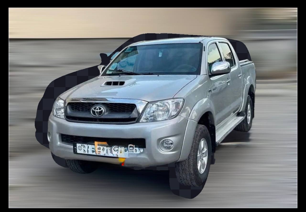 Side view of white 2010 Toyota Hilux Double Cab for sale in Addis Ababa