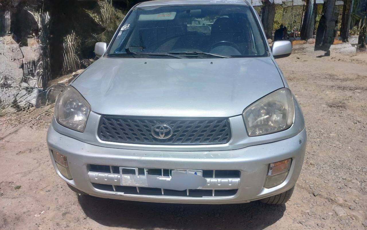 Exterior of a silver 2001 Toyota RAV4 for sale in Addis Ababa Interior leather upholstery of a 2001 Toyota RAV4 for sale.