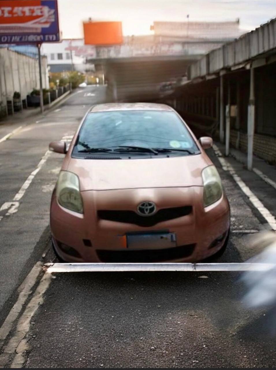 Yellow 2008 Toyota Vitz XP90 in pristine condition parked on a clean street in Addis Ababa.