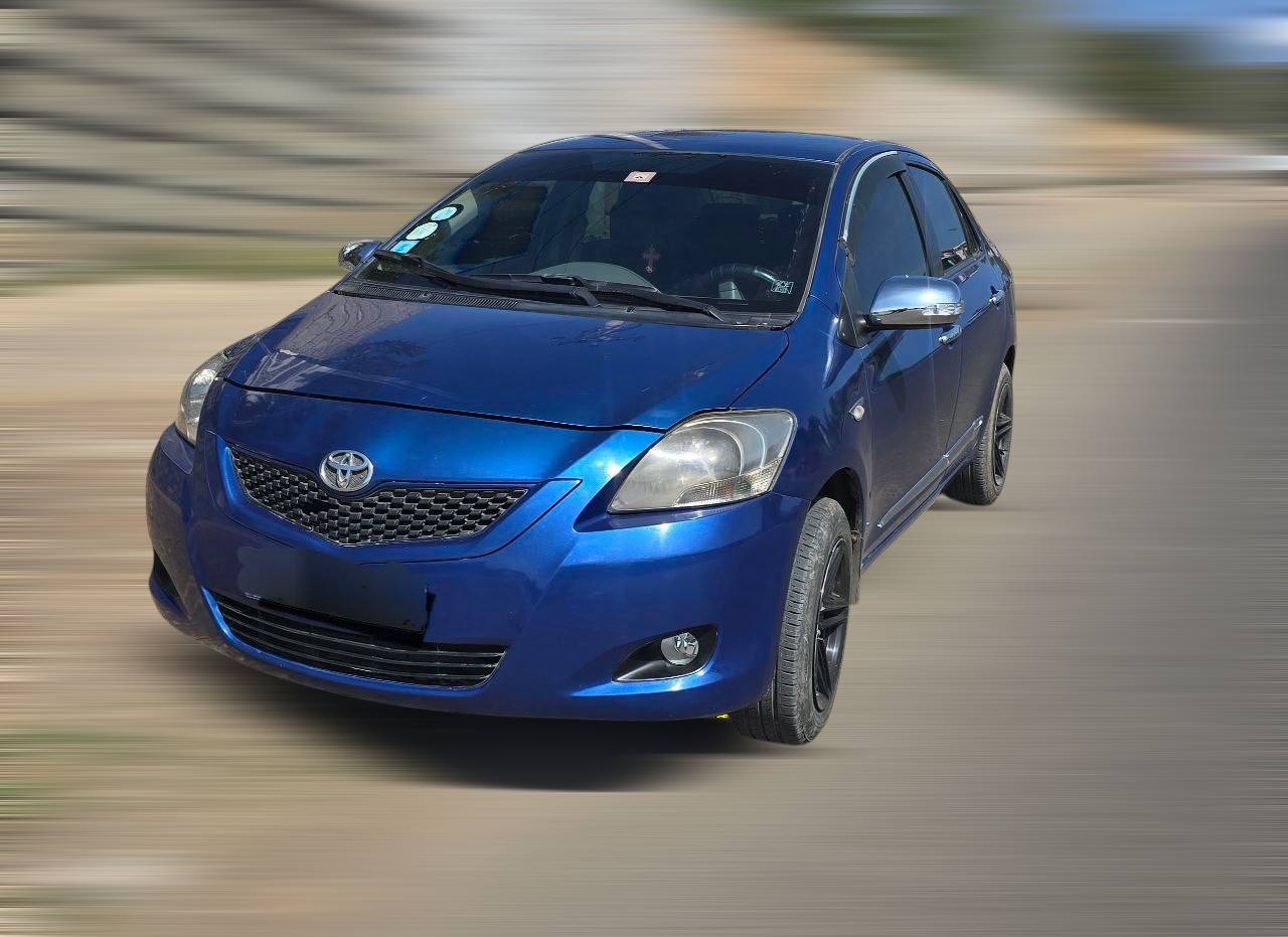Interior dashboard and upholstery of a clean 2011 Toyota Yaris for sale Ethiopia featuring a Bluetooth radio system.