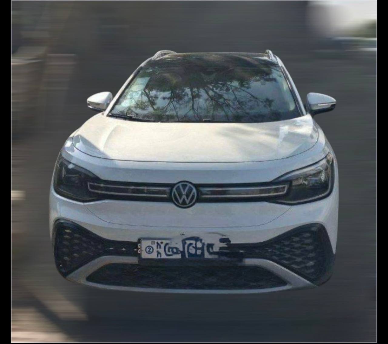 White 2022 Volkswagen ID.6 CROZZ electric SUV parked in Addis Ababa, showing the 7-seater exterior and modern LED headlights.
