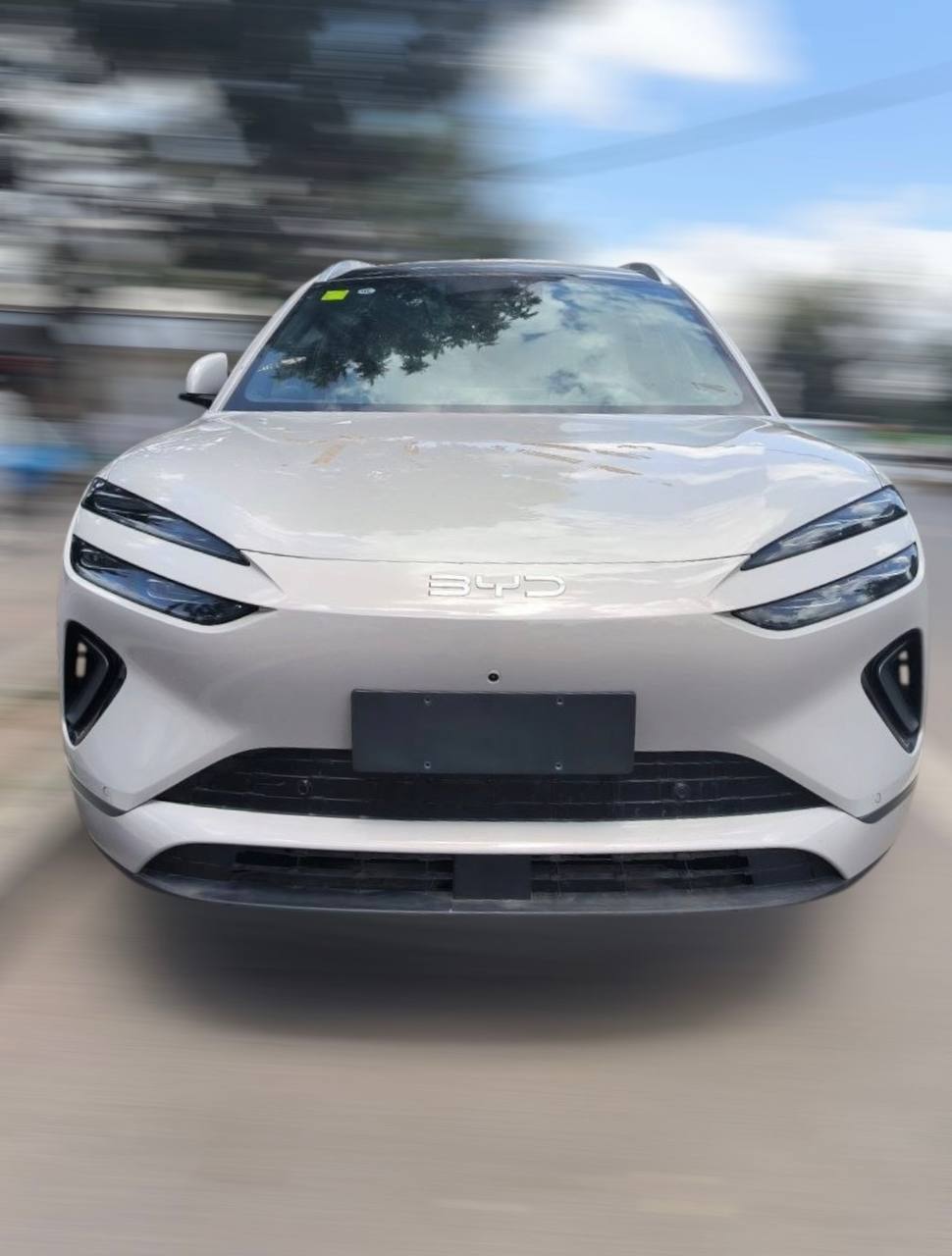 Front view of the 2026 BYD Sealion 06 EV in Ivory white