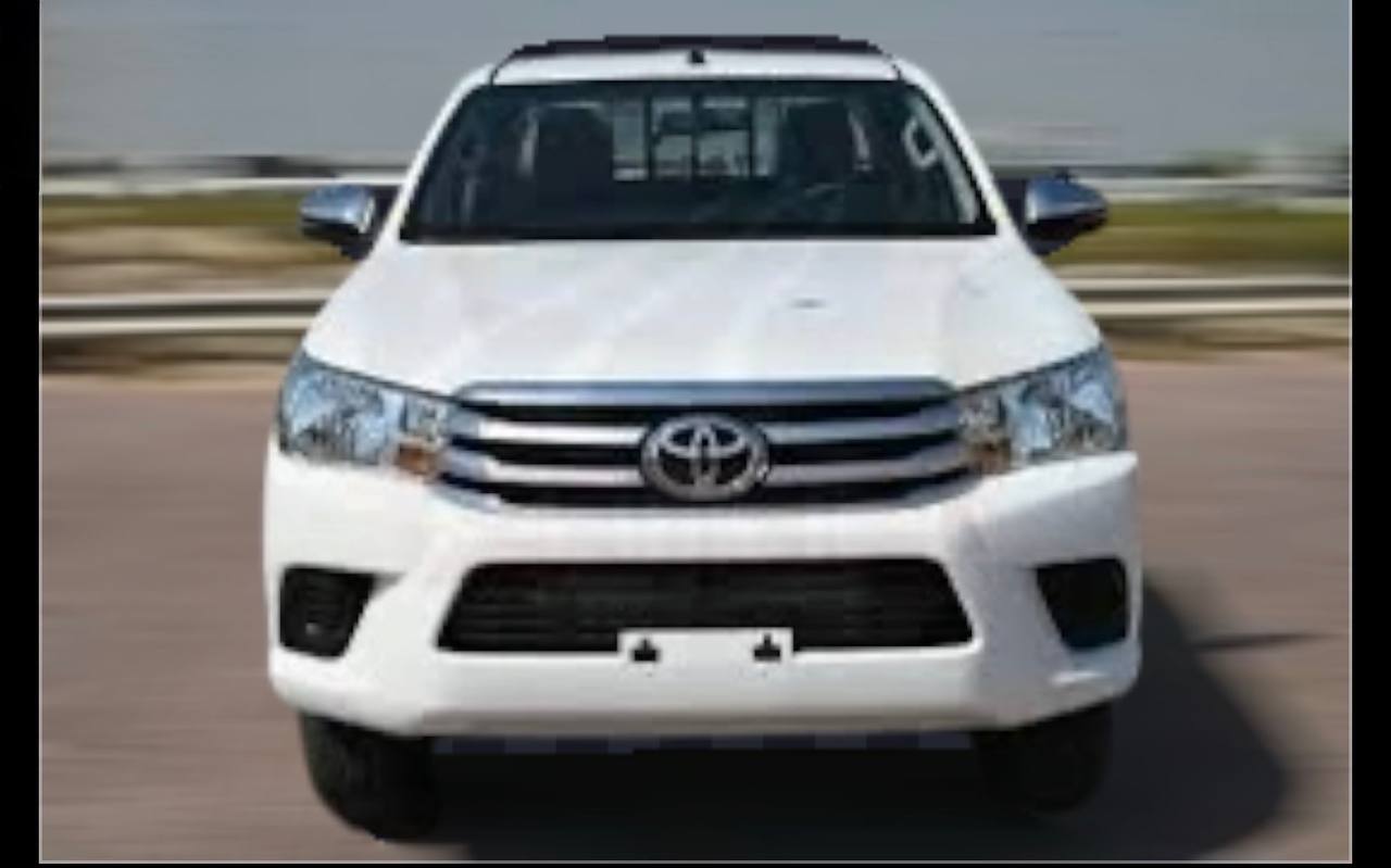 Front view of a white 2022 Toyota Hilux for sale Ethiopia with 2.8L Diesel engine and 4x4 drivetrain. Side profile of a 2022 Toyota Hilux Revo for sale in Addis Ababa Ethiopia.