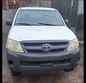 Side profile of factory standard 2008 Toyota Hilux Double Cab 4x4 in Super White for sale in Addis Ababa Ethiopia