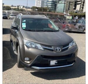 Left-profile view of a showroom-condition Pyrite Mica 2015 Toyota RAV4 XA40 SUV parked in Addis Ababa Ethiopia